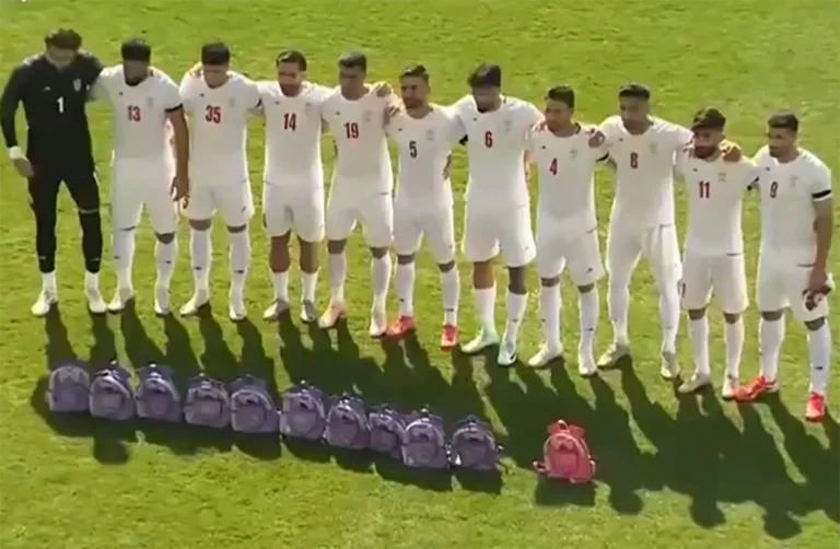 This video grab taken from images released by the Iranian state broadcaster (IRIB) on March 27, 2026 and released via AFPTV, shows the country's football national team paying tribute to the victims of the February 28 strike on an elementary school in Minab, ahead of their friendly football match with Nigeria in Turkey's Antalya. The biggest loss of life for civilians in the war so far was the airstrike on an elementary school in Minab on the first day of the war that killed at least 165 people, according to an official toll. (Photo by IRIB TV / AFP) /